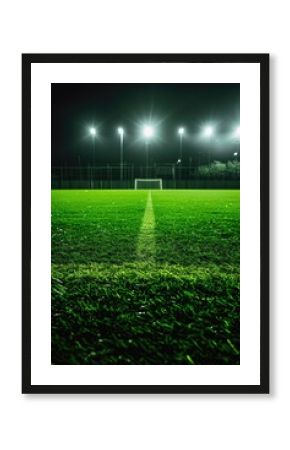 A well-lit soccer field at night, perfect for sports or training