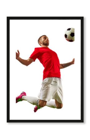 Banner. Young fit man, soccer player ready to kick a soccer ball on green grass field against transparent background. Concept of professionals sport, competition, tournament, energy, action.