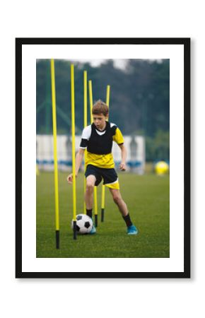 Soccer Players Running With Balls in Between Training Poles. Football Practice Session for Youth Sports Club
