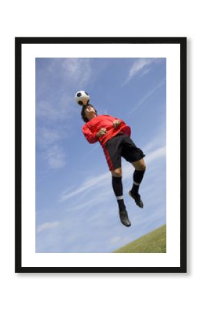 soccer football player making header
