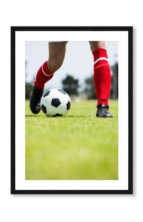 Football player practicing soccer