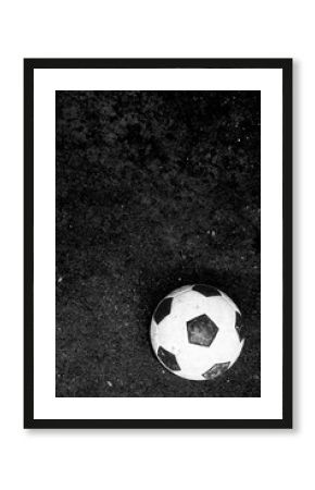 Dirty football, soccer ball move to forward black and white image, photo