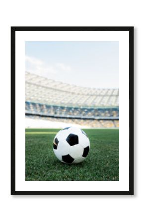 soccer ball on grassy football pitch at stadium