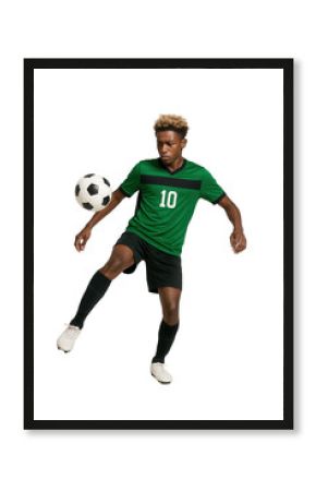 Young male soccer player kicking black and white ball in green and black uniform with transparent background