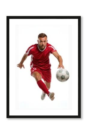 Dynamic Male Soccer Player in Red Jersey Kicking a Soccer Ball
