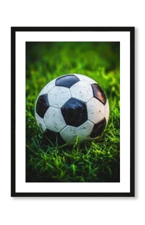 Photorealistic soccer ball on grass with bold contrast and depth