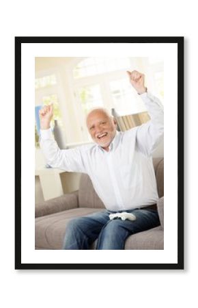 Senior happy winning computer game