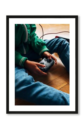 Kid playing with a video game console at home