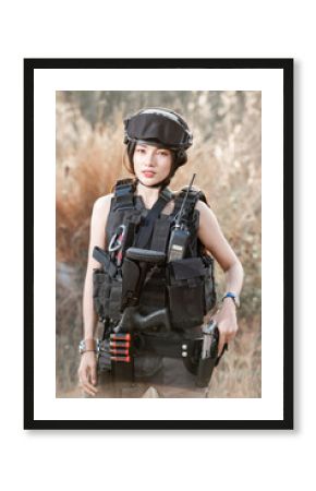 Portrait of beautiful sexy woman with shotgun and Pistol in a shooting computer game ESports SWAT fighter, police tactical concept..