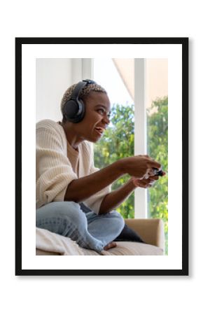 Happy woman playing videogame at home