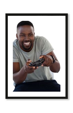 Man playing video game against white background