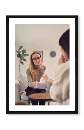 Female psychologist listening to client during session