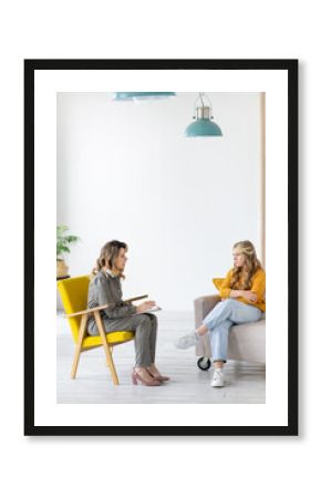 Woman psychologist works with teenage girl in her office. Mental health.