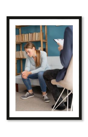 Psychologist working with a teenager in his office. Psychotherapy session with professional psychologist.