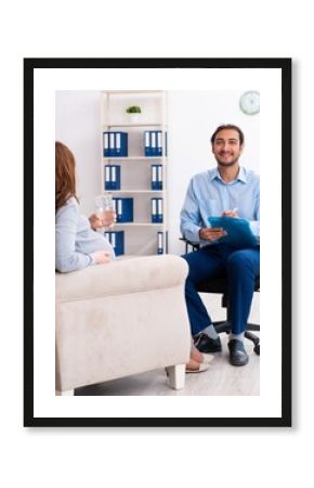 Pregnant woman visiting young male psychologist