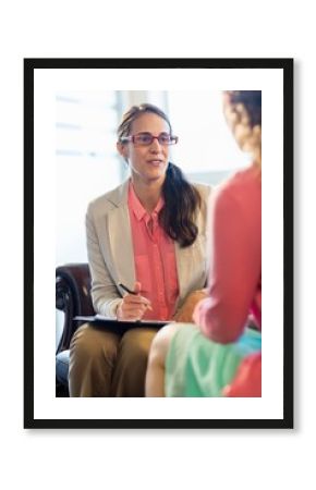  Beautiful young woman discussing with psychologist