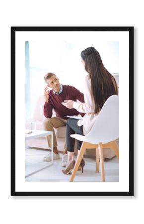 male patient having therapy appointment at psychologist office