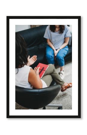 Psychotherapy session, woman talking to his psychologist in the studio