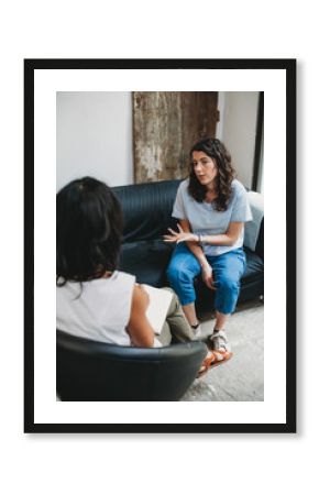 Psychotherapy session, woman talking to his psychologist in the studio