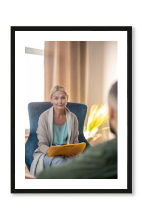 Beautiful stylish psychologist having conversation with patient