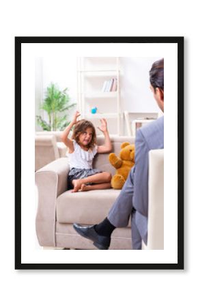 Child psychologist attending small girl