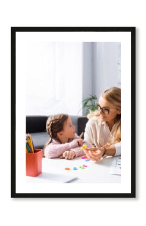 girl patient calculating with figures while visiting psychologist, stock image