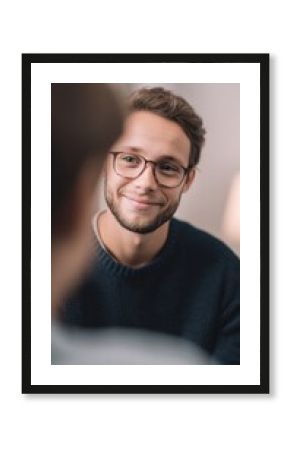 psychologist smiling gently listening to teenager speak warm atmosphere