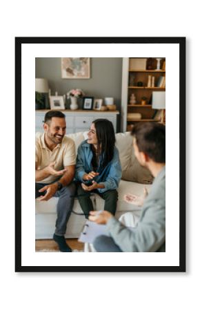 Young couple discussing with their psychologist during therapy session