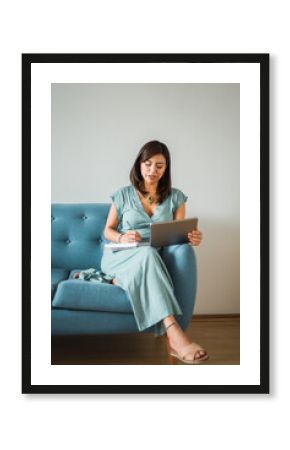 Vertical image of a psychologist taking notes on a video call from home. Copy space.