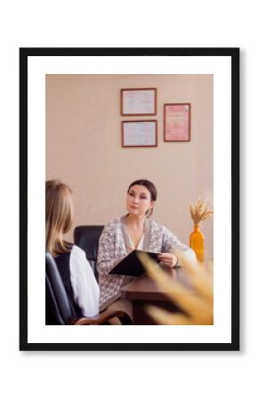 Young woman suffering from work stress, anxiety. Consultation with therapist. Business lady on psychologist counseling