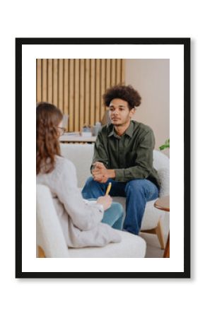 young man in consultation with psychologist is taking care of mental health. Psychotherapy for treatment of disorders and depression, insomnia. African American guy tells doctor about his problems