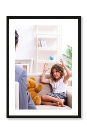 Child psychologist attending small girl