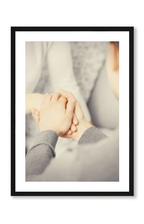 Man and woman holding hands closeup