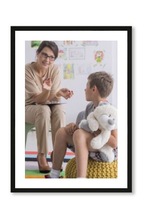 Boy is holding stuffed toy