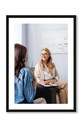 back view of woman having consultation with therapist