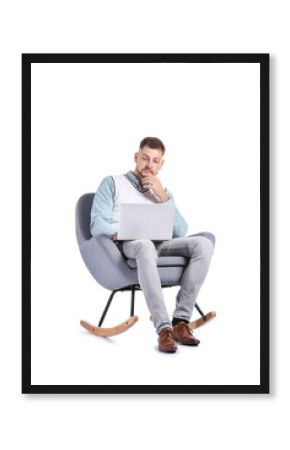Male psychologist with laptop sitting in armchair on white background