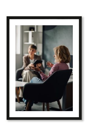 Patient explaining problems to psychologist during therapy session