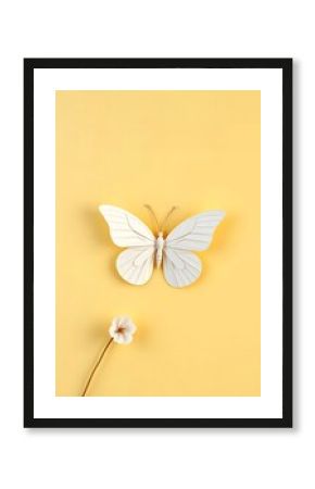 White butterfly and flower on yellow background minimalist spring aesthetic