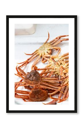several freshly caught Kamchatka crabs on board
