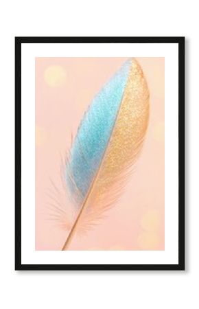 Blue and Gold Glitter Feather on Pink Background