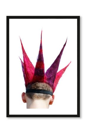 A man with a spiked red and purple hair style is wearing a crown