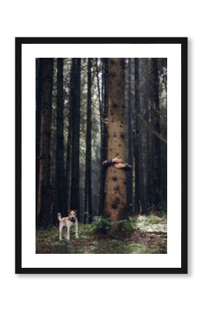 Woman hand embracing a tree in green forest - nature loving, fight global warming, save planet earth