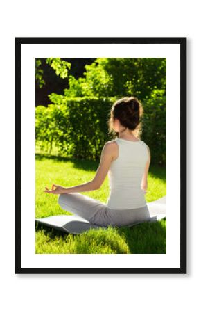In the lotus position on the nature background