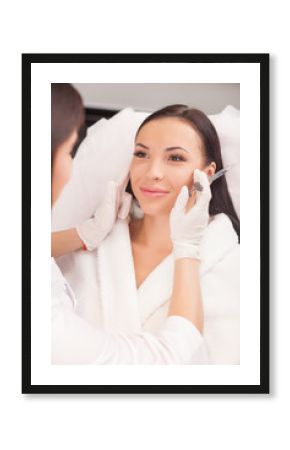 Attractive young lady is visiting her cosmetician