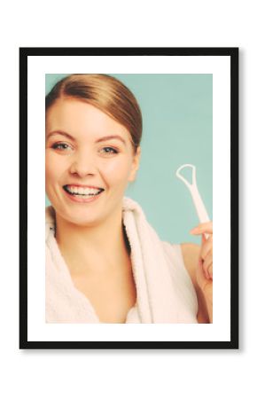 Girl with tongue cleaner.