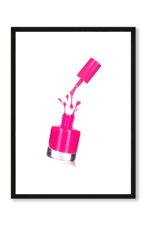 pink nail polish bottle with splash isolated on white