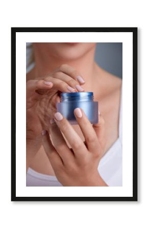 female hands holding cream