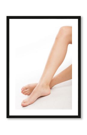 Legs of young woman on the white background.