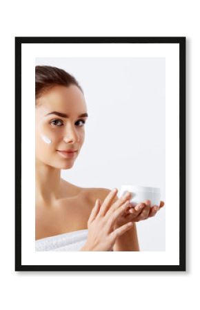 Gorgeous woman holding skin cream. This is the best cosmetic product. Holding Moisturizing Lotion. Beauty Concept