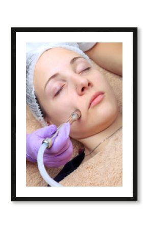 Diamond microdermabrasion, peeling cosmetic. woman during a micr